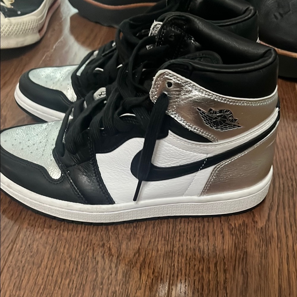 Nike Jordan Black and Silver High-Top Sneakers purchased from StockX.